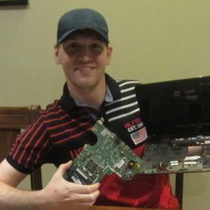 Joseph replacing a client's motherboard